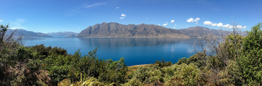 Panoramic view of lake, mountains, and shoreline from The Neck.