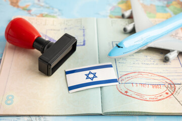 Israel flag with passport and airplane for travel.