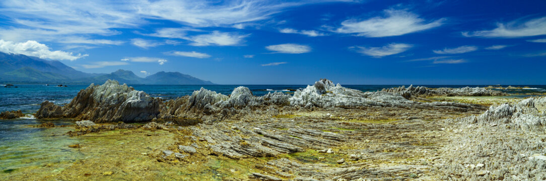 Panorama of the geological coastal formations with Kaikoura Ranges in background