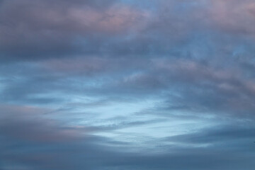 Calm Evening Sky With Soft Clouds At Dusk Over a Quiet Horizon