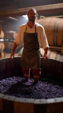 A traditional winemaking scene showcasing a vintner joyfully stomping grapes in a large wooden vat, capturing the essence of the harvest and the art of crafting fine wine.