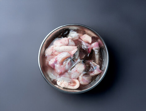 Raw monkfish cut into pieces on a plate