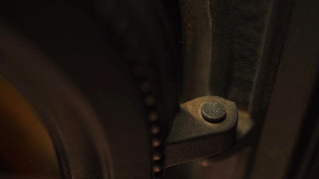 The hinge holding the fireplace door, close-up