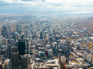 Obraz premium Autumn aerial view of Montreal downtown skyline with high-rise buildings under cloudy sky. g