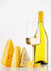 Obraz premium Assorted cheeses and wine on white background