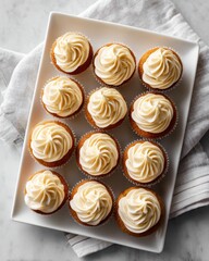 Fototapeta premium Tray of small cream tarts on parchment