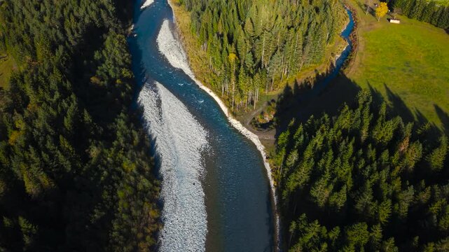 Lechtal in Austria showing turquoise Lech river winding through autumn landscape and Alps, aerial view