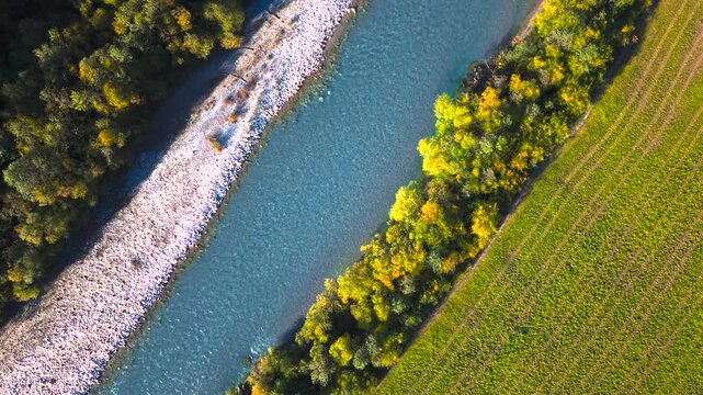 Lechtal valley from above showing colorful forests, green fields and Lech river in Austria, aerial shot