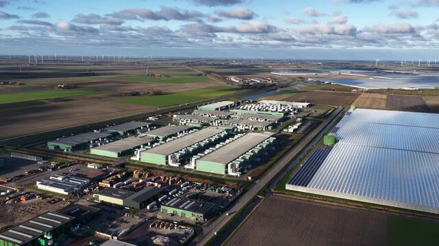 Close up aerial drone video of big data infrastructure, visualizing large scale data storage, databases, and analytics systems used for machine learning, data science, and predictive business insights