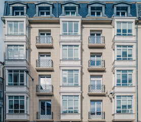 Symmetrical Residential Building Facade with White Bay Windows, Classic European Architecture