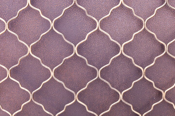 Intricate patterns of miruksers decorative metal work captured in warm light