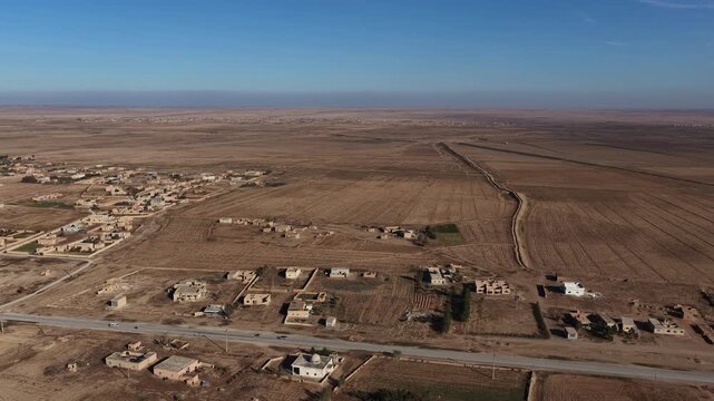 Drone shot capturing the vast, arid desert environment surrounding Al-Shaddadi in Al-Hasakah province, Northeast Syria. 