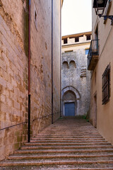 Obraz premium A Medieval street with stairs in the city of Girona, Catalonia, Spain. 