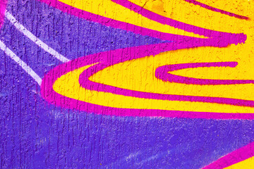 Naklejka premium Abstract graffiti with purple, yellow, pink swirls. 90s, Y2K style, vibrant colors, street art texture. Posters, digital art, creative banner, summer visuals, urban background.