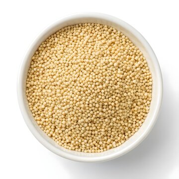 Proso Millet Seeds On A White Solid Background, Close Up Macro Shot Of Tiny Golden Grains, Representing Ancient Gluten Free Superfood, Organic Nutrition, Healthy Eating, And Sustainable Living