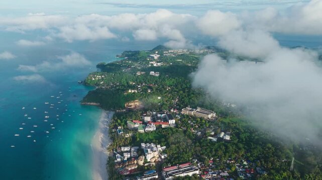 Cinematic aerial of world-famous White Beach, turquoise sea in tropical paradise