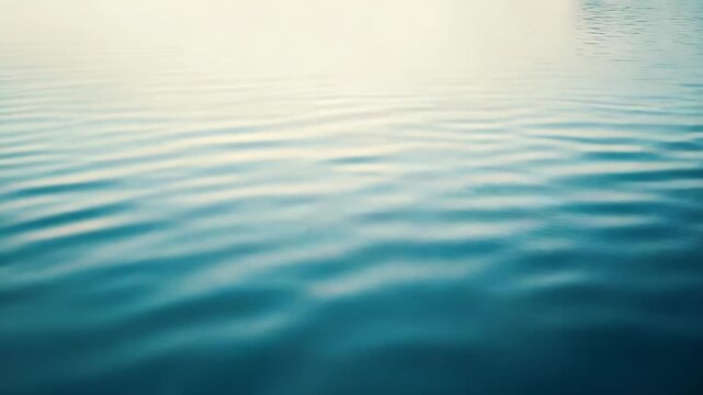 Water surface with gentle ripples and soft reflections forming a serene blue gradient backgroundcalm, clean aquatic texture ideal for tranquil, minimalist compositions