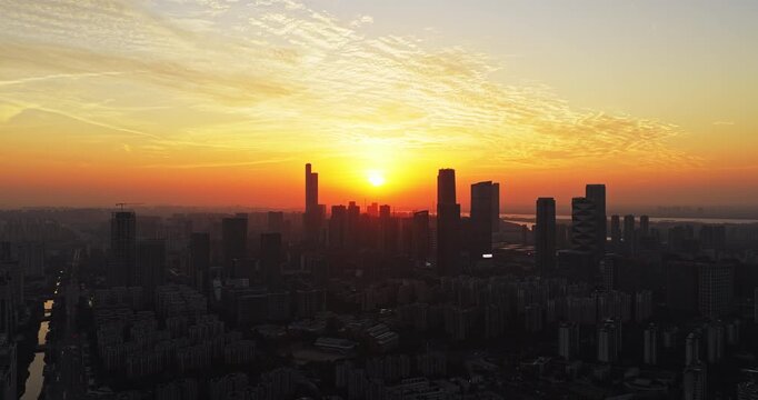Aerial view of modern city at sunset