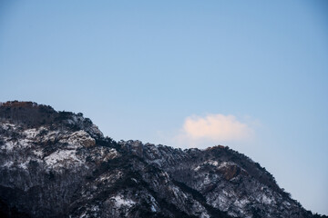 Majestic mountain ridges covered with white snow under a clear blue sky in Korea