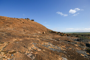 Granite dome of The Humps rising above the Wheatbelt near Hyden, Western Australia