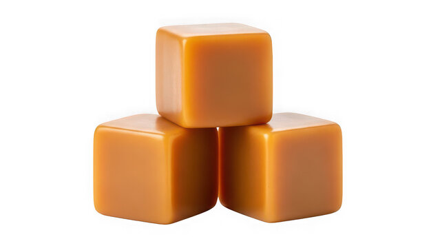 Three soft square caramel candy cubes stacked together isolated on transparent background