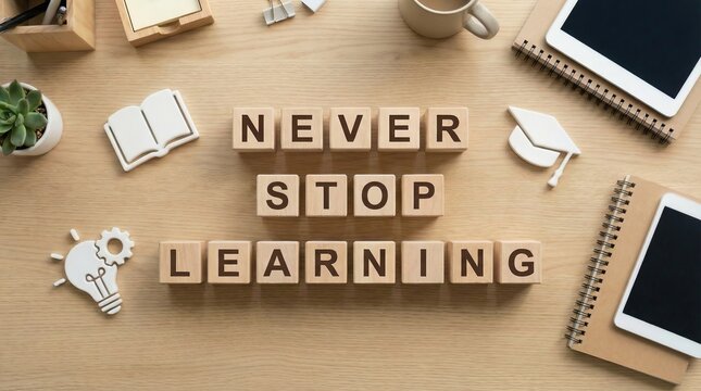 Wooden cubes 'Never Stop Learning' on table, lifelong development