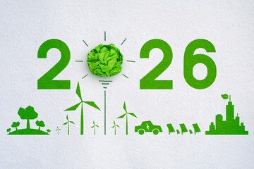 Green crumpled paper light bulb, 2026, Corporate Social Responsibility (CSR), eco-friendly business and environmental concept