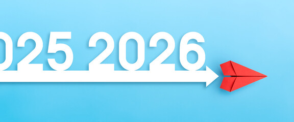 Red paper plane with arrow, 2026.