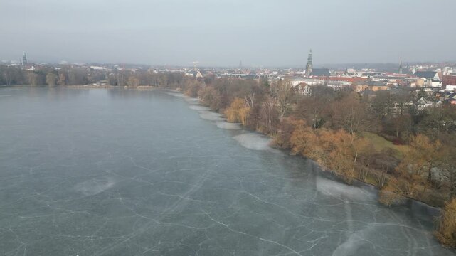 aerial view of the frozen swan pond in Zwickau winter landscape