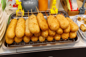 A tray of fried food with many pieces of food on it