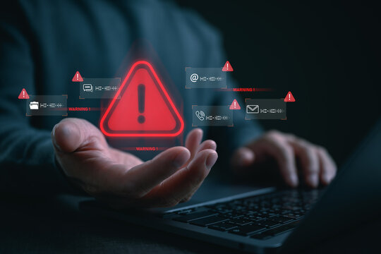 Person presenting red warning alert with digital communication, representing cyber threat detection, online scam warning, data breach risk, suspicious activity monitoring, digital security awareness.