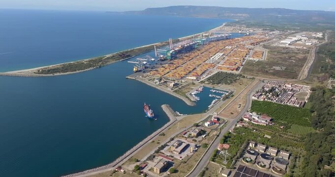 Aerial view of the industrial port of Gioia Tauro, located in the province of Reggio Calabria. It is the largest port in Italy by container throughput and the sixth largest in the Mediterranean Sea.
