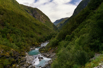 wooden suspension bridge across the Utla River in the Utladalen Valley in central Norway
