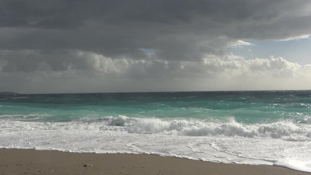 A strong, stormy wind breaks huge waves of the Mediterranean Sea on the beaches of the coast of Antalya, Turkey.
