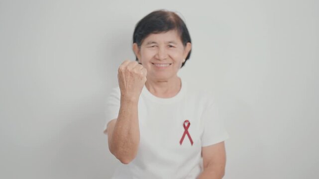 Elderly with Burgundy Ribbon for March Multiple Myeloma Cancer Awareness month, September Sickle Cell Anemia, Headache and Migraine week, April world Meningitis day, October Hospice  Palliative care