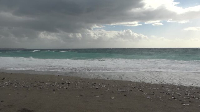 A strong, stormy wind breaks huge waves of the Mediterranean Sea on the beaches of the coast of Antalya, Turkey.