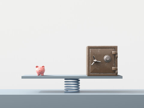 Piggy bank and safe balanced on spring symbolizing finance stability
