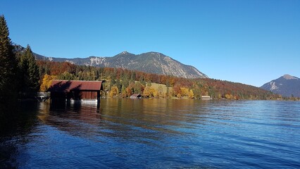 Lake Walchensee in Bavaria showcased across all four seasons in an alpine mountain setting.