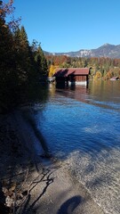 Lake Walchensee in Bavaria showcased across all four seasons in an alpine mountain setting.