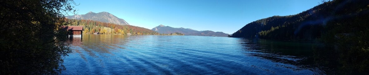 Lake Walchensee in Bavaria showcased across all four seasons in an alpine mountain setting.