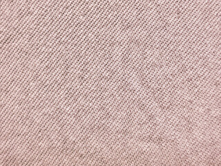 soft beige knit fabric texture closeup radiating cozy warmth with intricate weave patterns in neutral earthy tones © Arthur