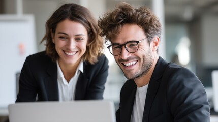 Fototapeta premium Onboarding Moment With Manager and Team Member Working Together at a Laptop in a Modern Office Setting During the Day