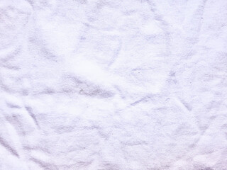 soft white terry cloth texture closeup with delicate wrinkles on pale blue canvas evoking serene spa tranquility