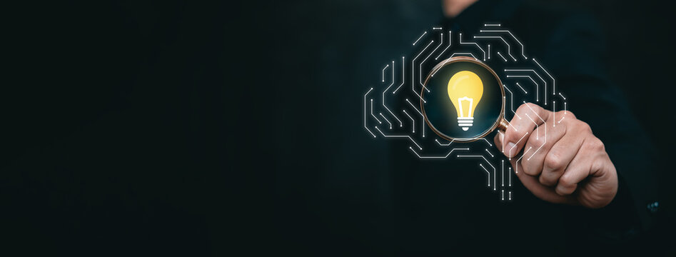 Conceptual image of innovation and artificial intelligence insight represented by magnifying glass and glowing idea within digital brain. Symbol of creative strategy, advanced technology.