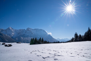Snow-covered Buckelwiesen near Mittenwald set within the winter alpine mountains.
