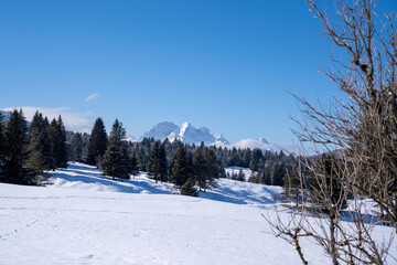 Snow-covered Buckelwiesen near Mittenwald set within the winter alpine mountains.