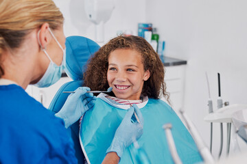 Cute little girl smiling during dental visit