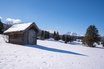 Snow-covered Buckelwiesen near Mittenwald set within the winter alpine mountains.