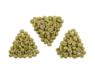 Three piles of green coffee beans isolated on white background