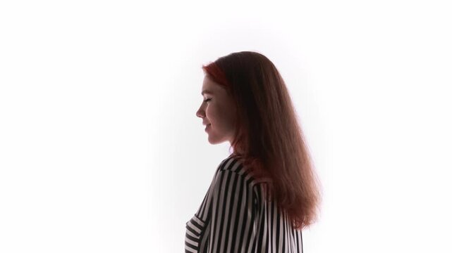 Redhaired woman facing camera during 360 degree rotation. Concept of digital magazine cover, online editorial content, interactive media projects, and immersive storytelling visuals.